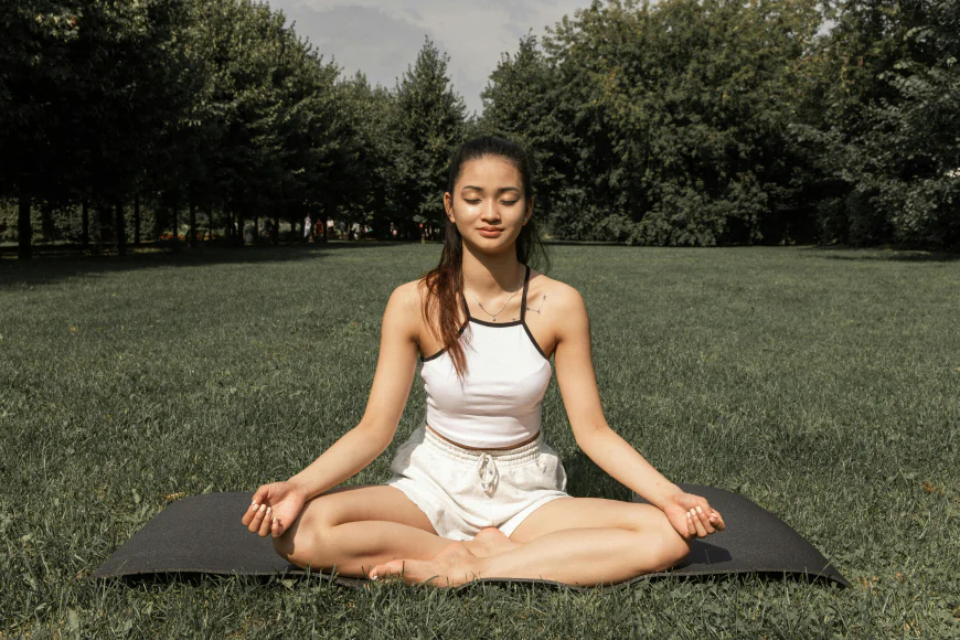Padmasana (Lotus Pose): Padmasana is a classic meditative posture where the legs are crossed with each foot resting on the opposite thigh. This pose enhances focus, balances energy, and prepares the body for meditation by creating a stable base