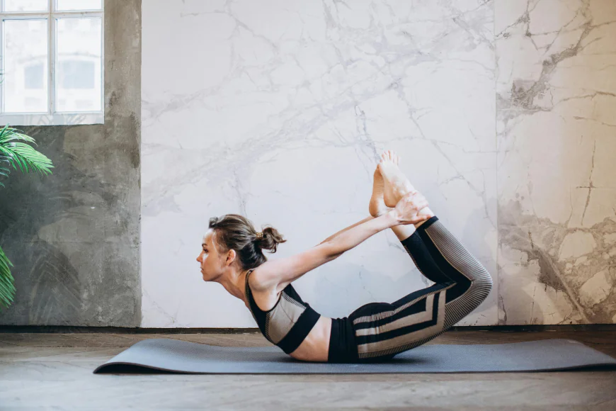 Dhanurasana (Bow Pose): By arching into a bow shape, this pose opens up Manipura Chakra (solar plexus), enhancing confidence and willpower. YOGAKSHTI - STRENGTH IN YOU